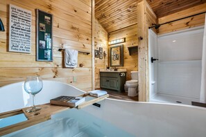 Bathtub, jetted tub, hair dryer, towels