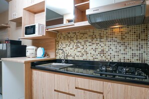 Private kitchen - Best Homey Studio at The Oasis Apartment (Cikarang)