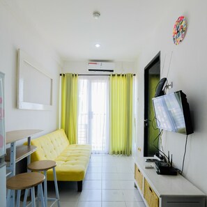 Room | Living area | TV - Homey 2BR Apartment at Paragon Village (Curug)