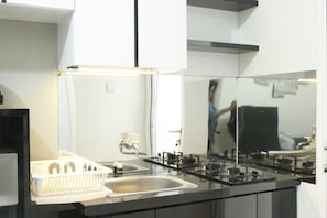 Room | Private kitchen - Direct Access to Pool 2BR Apartment at Parahyangan Residence (Bandung)