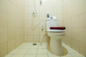 Habitación | Baño | Regadera y toallas 