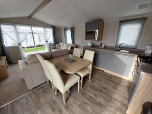 DV B12 Caravan | Living area | Flat-screen TV, fireplace - Dainville Caravan Park (Skegness)