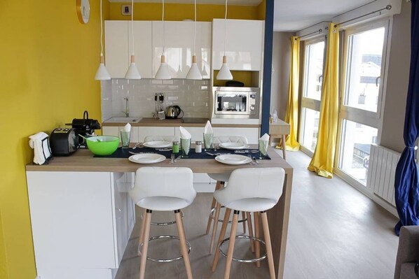 Fridge, microwave, stovetop, coffee/tea maker