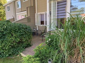 Enjoy a serene retreat in this two-story home with a patio and beautifully manicured surroundings.