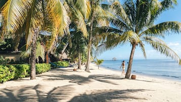 On the beach, sun-loungers, beach umbrellas, beach towels