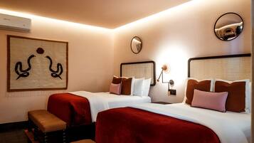 Premium bedding, down comforters, Tempur-Pedic beds, minibar