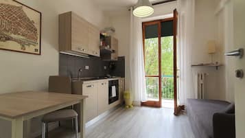 Family Studio | Living area | 28-inch flat-screen TV with digital channels, TV