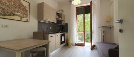 Family Studio | Living area | 28-inch flat-screen TV with digital channels, TV