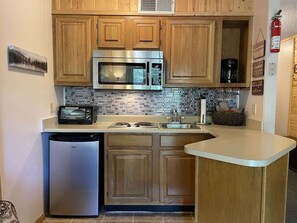 Fridge, microwave, stovetop, coffee/tea maker