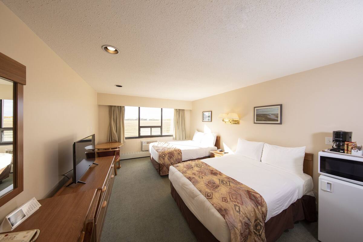 Pillow-top beds, desk, laptop workspace, blackout curtains