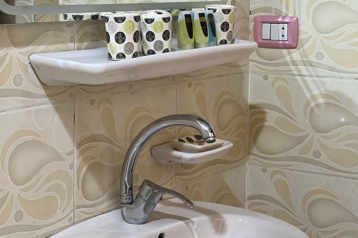 family room | bathroom | rainfall showerhead, slippers, towels, soap