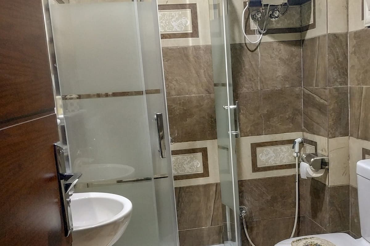 single room | bathroom | rainfall showerhead, slippers, towels, soap