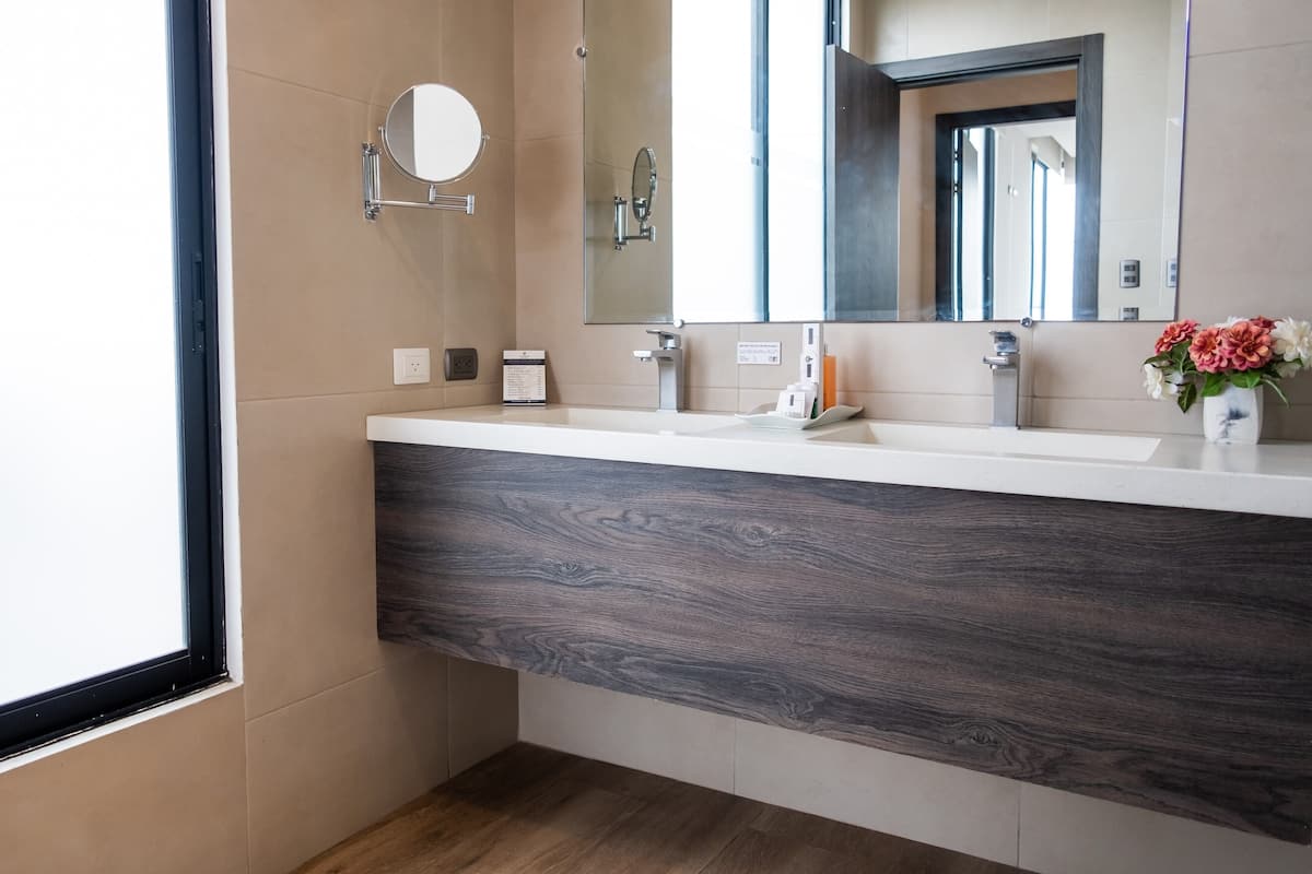 junior king suite | bathroom | shower, rainfall showerhead, towels, soap