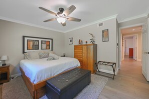 A bedroom with a bed, a ceiling fan, a wardrobe, and a bench. - Beautiful Modern Clean Family 1 Story Home! Near Disneyland, Chapman Convention (Orange)