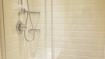 Luxury Studio Suite #3 | Bathroom | Shower, hair dryer, towels, soap