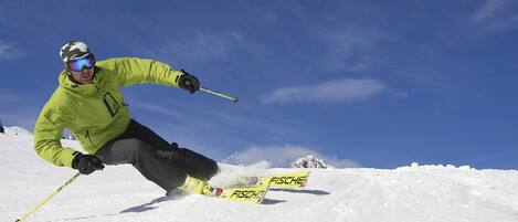A person skiing on a snowy slope.