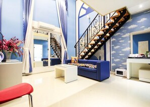 Suite (World) | Living area | 49-inch LCD TV with cable channels, TV, computer