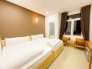 Deluxe Double Room | Minibar, desk, laptop workspace, blackout drapes