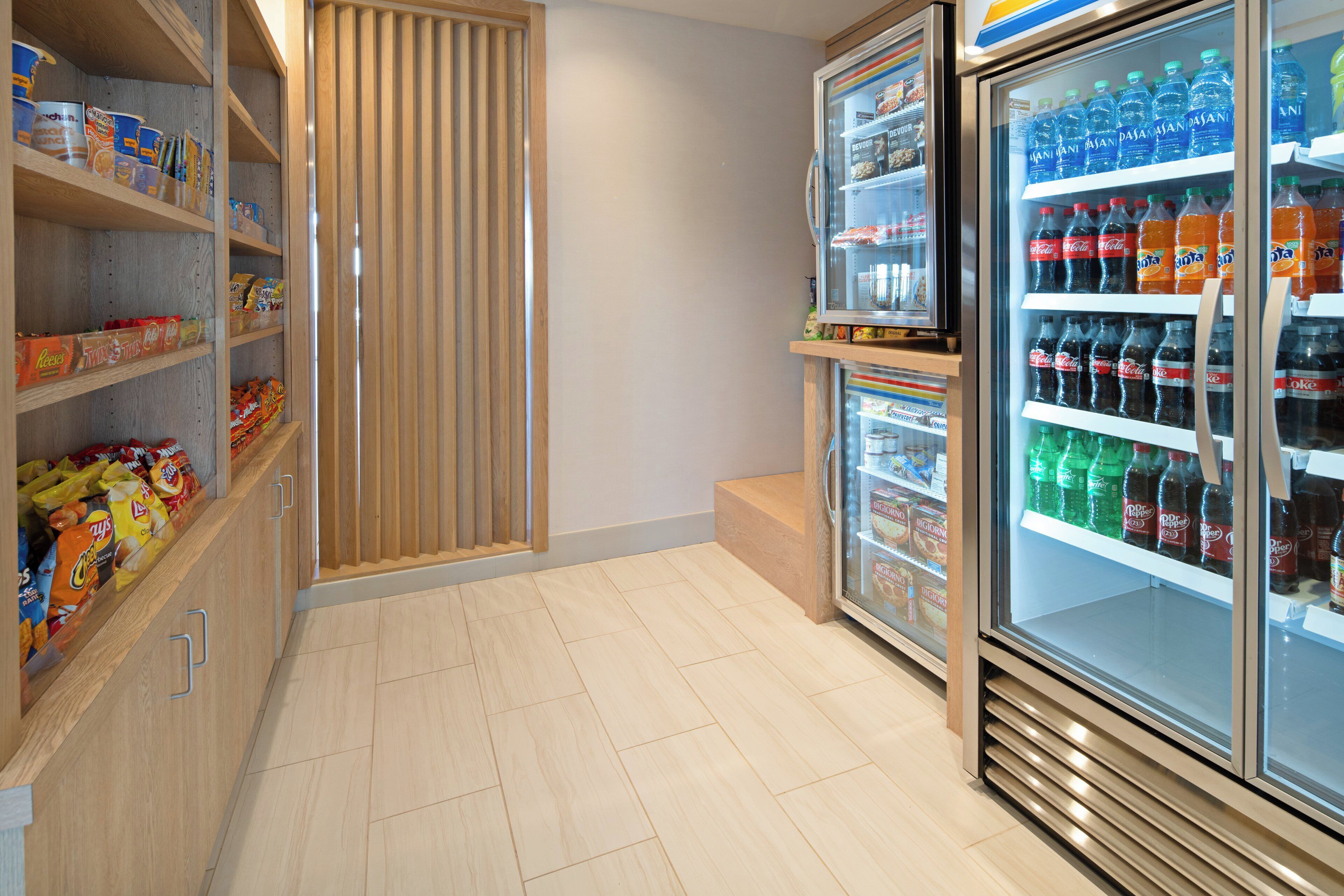 A snack and beverage section with shelves stocked with various snacks and drinks.