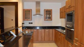 Fridge, microwave, cookware/dishes/utensils