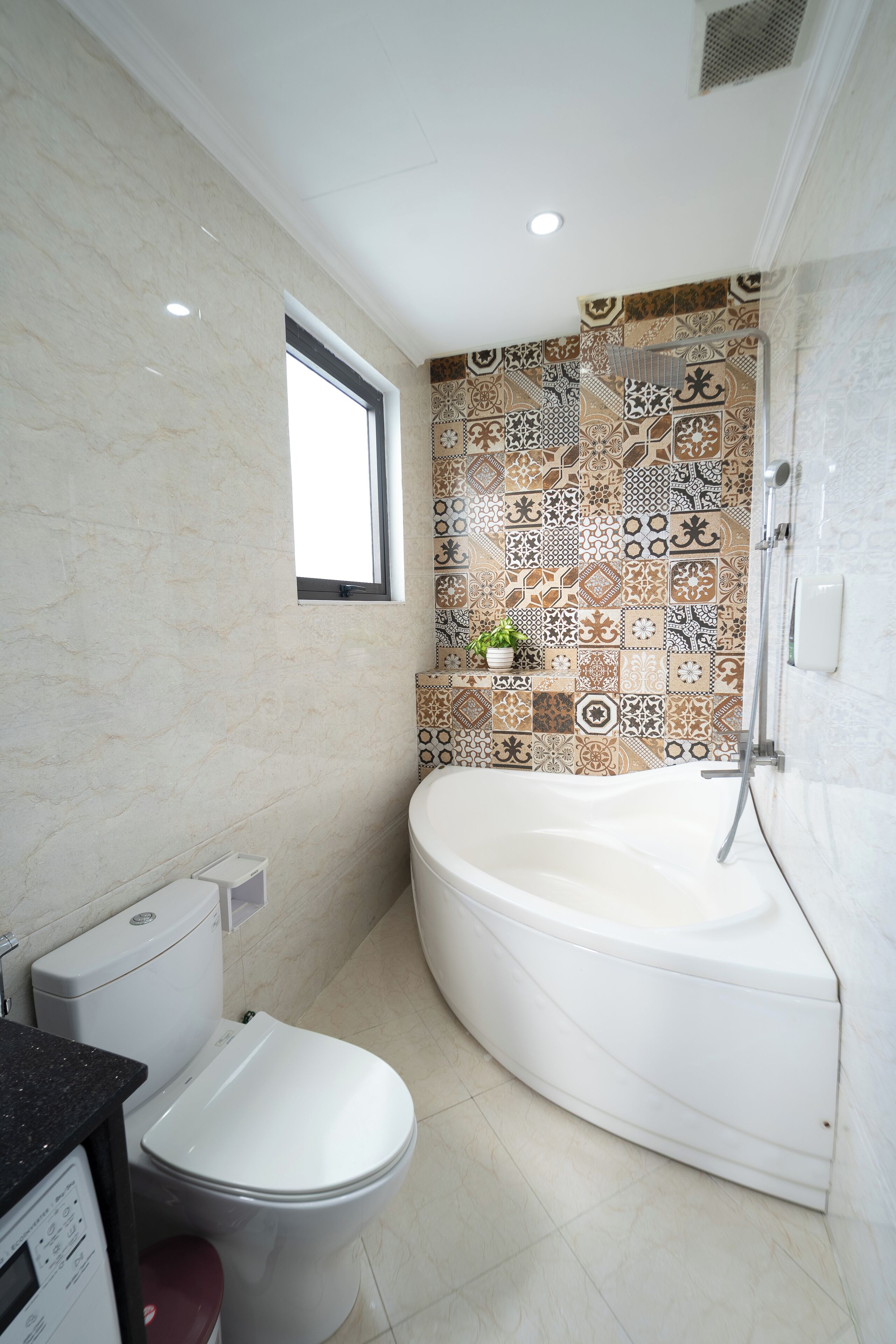 A bathroom with a toilet, a sink, and a bathtub.