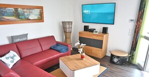 Apartamento | Área de estar | TV 40 polegadas com canais via satélite