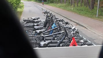 A row of bicycles parked in a rack.