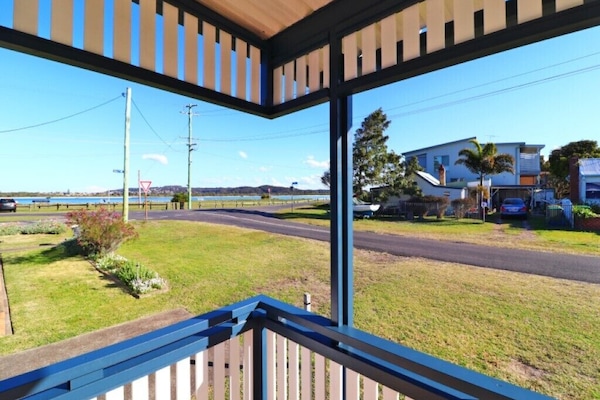 Sit on the porch and enjoy the view of the Swansea Channel!