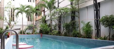 Outdoor pool, pool umbrellas, sun loungers