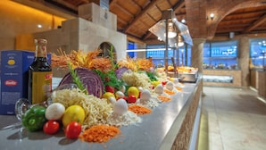 A buffet setup with various food items and condiments. - Ölüdeniz Turquoise Hotel (Fethiye)