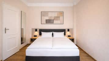 Hypoallergeen beddengoed, een minibar, verduisterende gordijnen