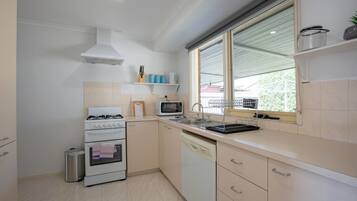 Fridge, microwave, oven, cookware/dishes/utensils