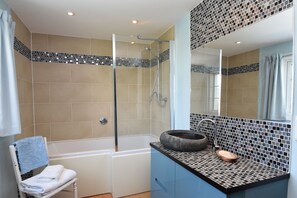 Combined shower/tub, hair dryer, towels, toilet paper