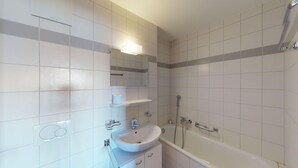 A modern bathroom with a white sink, mirror, and shower. - Pracondu 1 101 - OUTDOOR & FUN  apartment 8 pers (Haute-Nendaz)