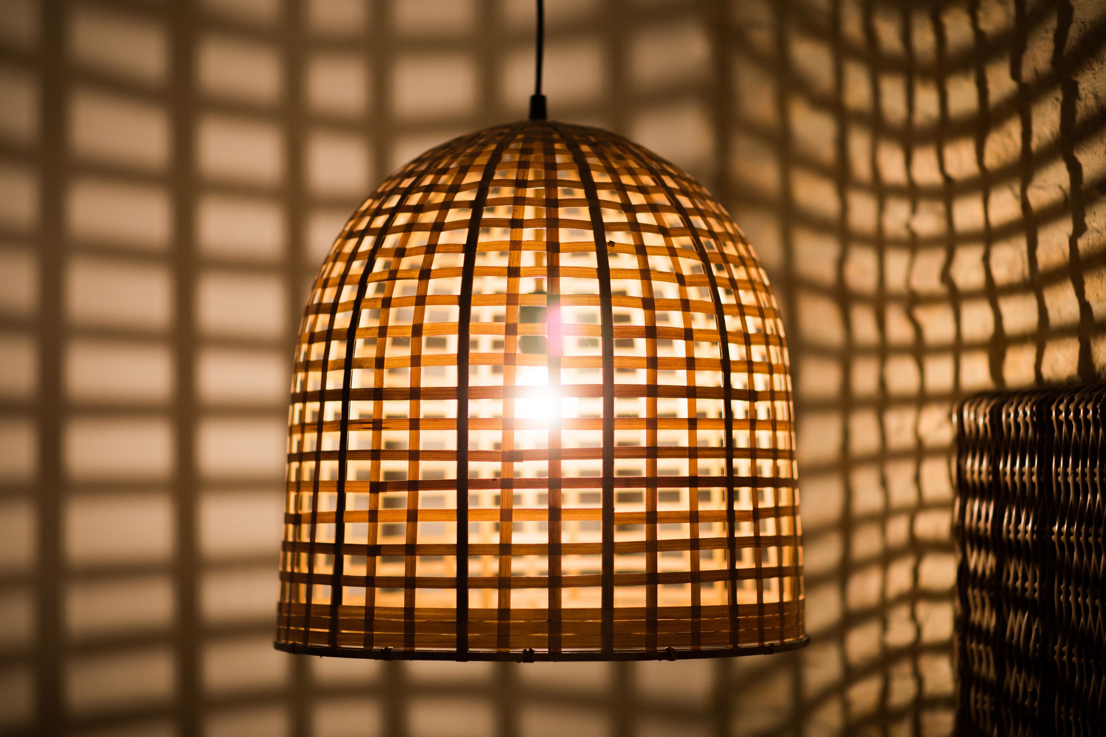 A hanging light fixture with a grid pattern.