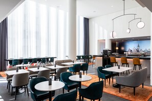 Relax in our spacious lobby with comfortable seating areas and a bar.