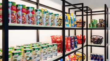 Shelves stocked with canned goods, snacks, and beverages.