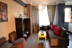 Executive Apartment | Living area | LED TV