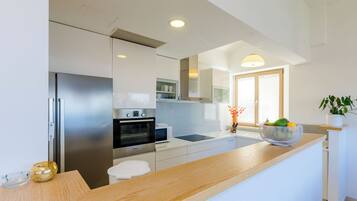 Villa (Four-Bedroom Villa, Swimming Pool) | Private kitchen | Fridge, stovetop, dishwasher, coffee/tea maker