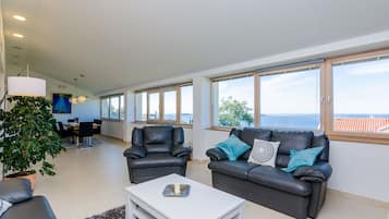 Villa (Four-Bedroom Villa, Swimming Pool) | Living room | 20-inch flat-screen TV with satellite channels, TV