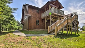 Enjoy the serene views from the upper-level balcony, overlooking the surrounding landscape.