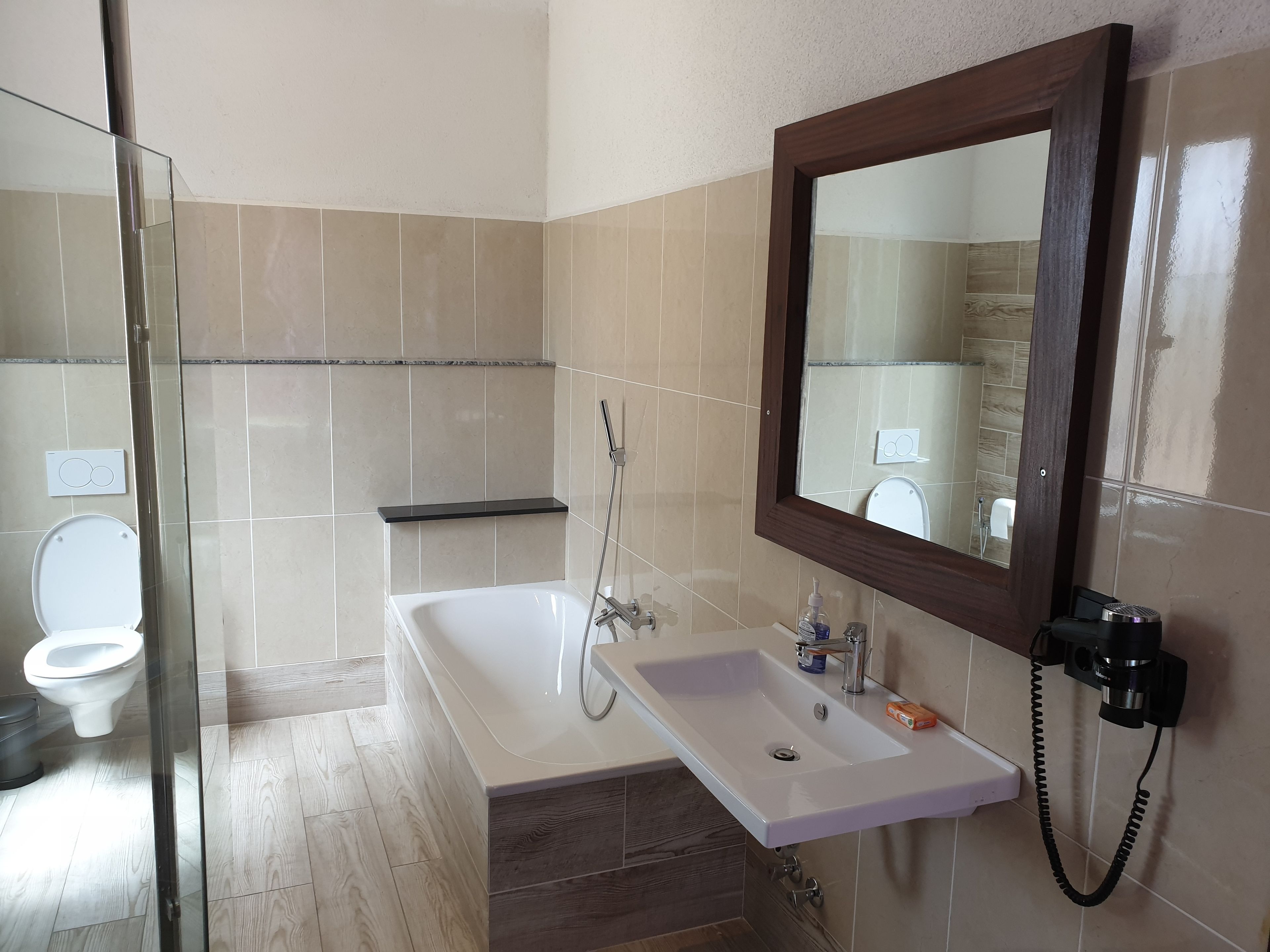 family suite, partial ocean view | bathroom | towels, toilet paper