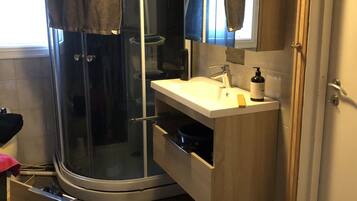 City House | Bathroom | Shower, towels, soap, toilet paper