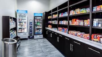 A self-service snack and beverage area with refrigerated and shelf-stocked options.