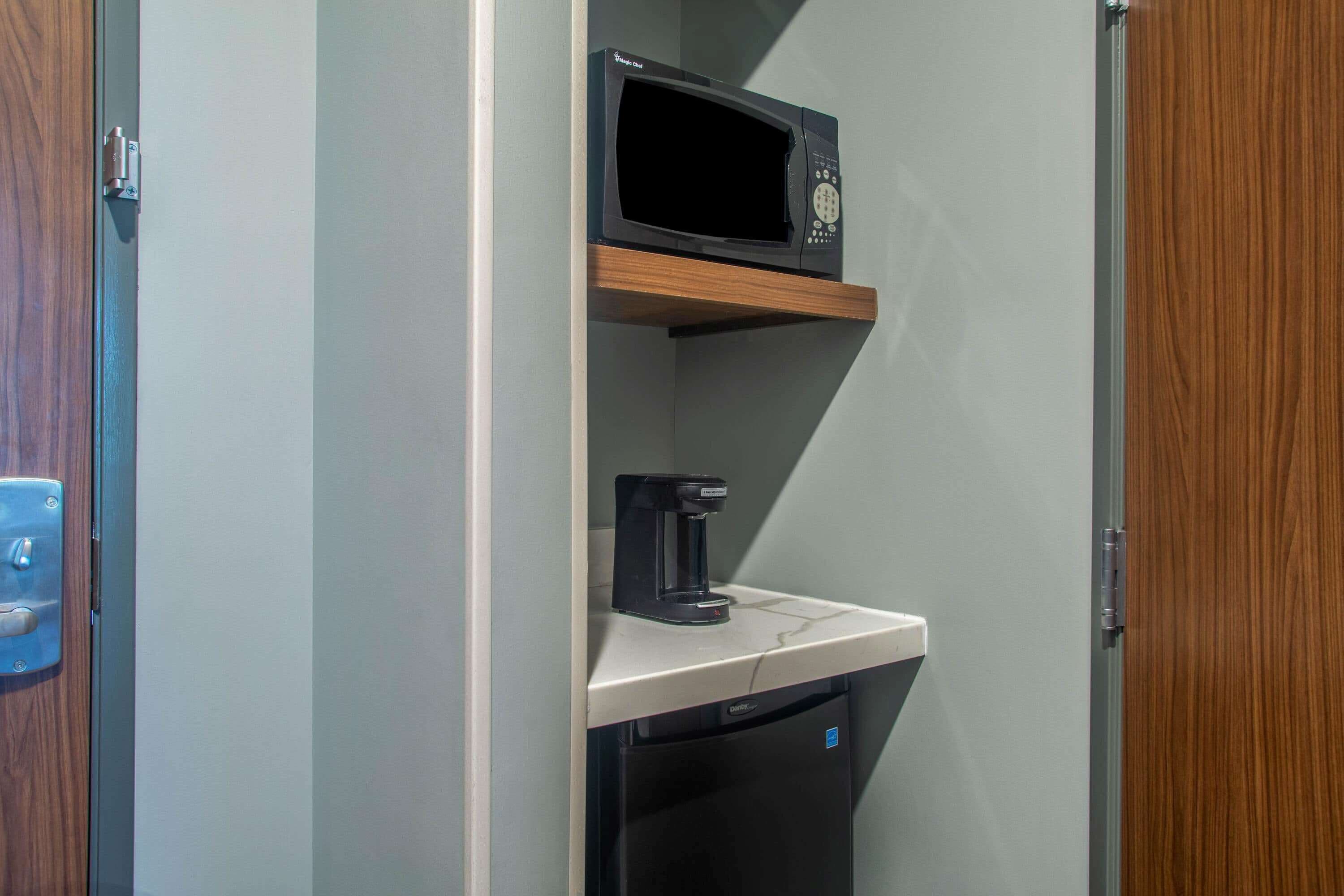 desk, laptop workspace, blackout curtains, iron/ironing board