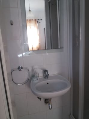 Shower, towels, toilet paper