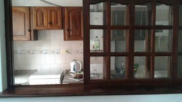 Full-sized fridge, oven, stovetop, cookware/dishes/utensils