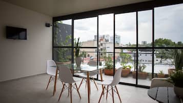 Deluxe Studio Suite, 2 Double Beds | Living area | 32-inch flat-screen TV with cable channels, TV, heated floors