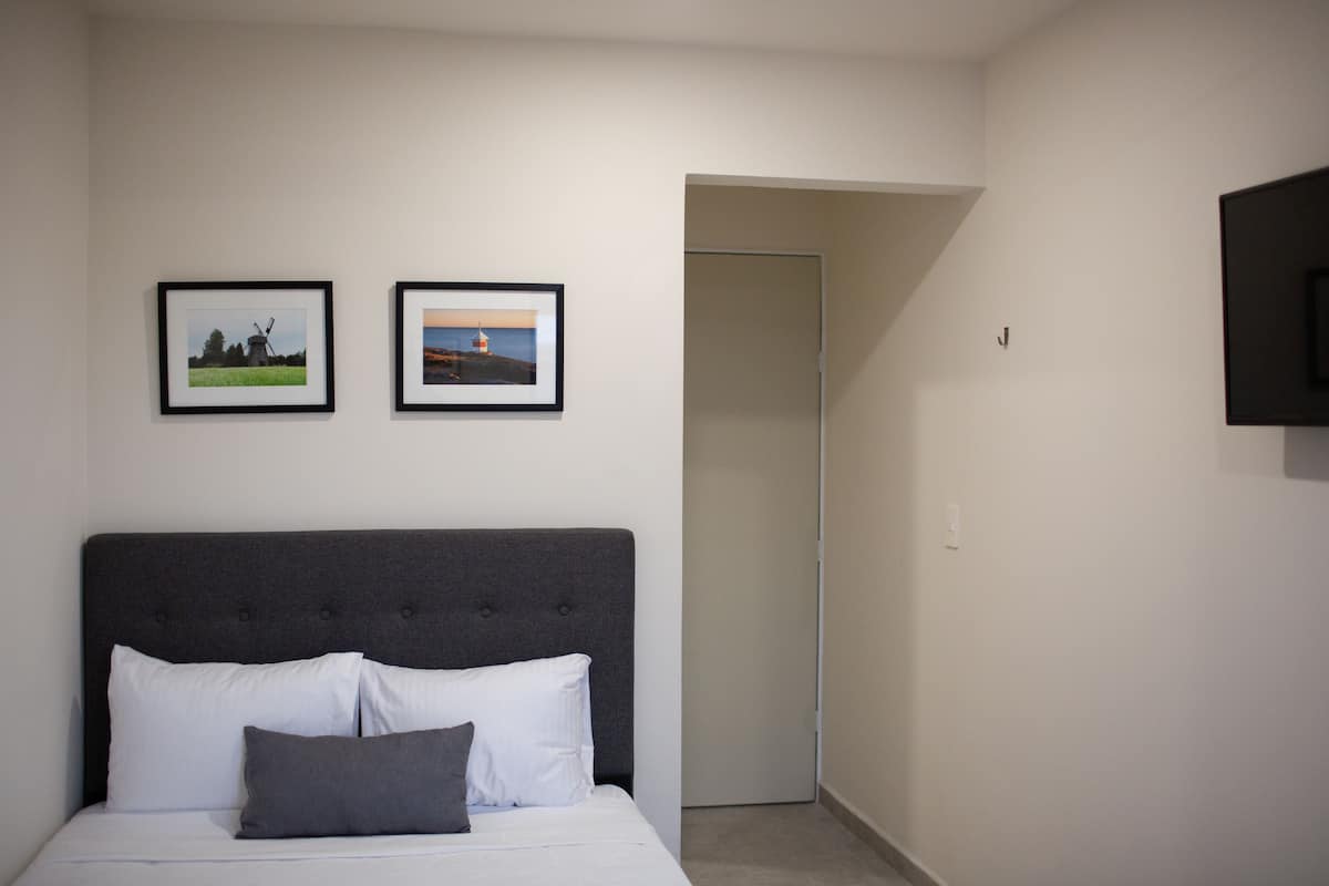 Premium bedding, down comforters, desk, laptop workspace
