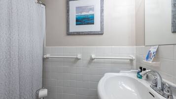 Combined shower/tub, hair dryer, towels, soap